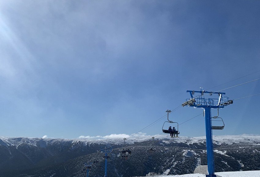 Chairlift and snowy slopes at Mount Buller