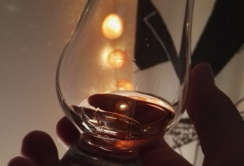Whisky glass with warm background lights