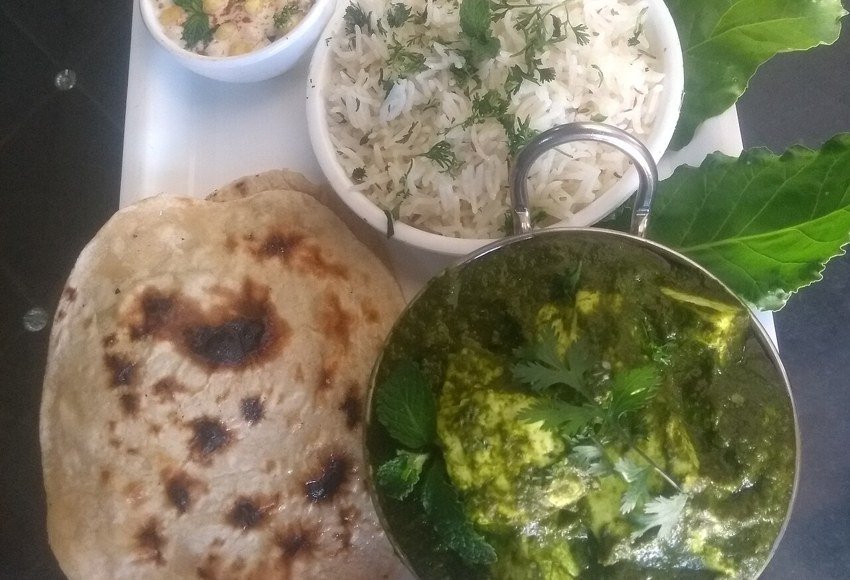 Palak paneer served with rice