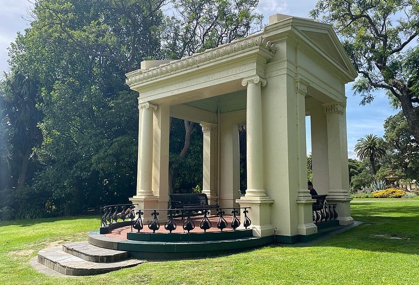 Tree-lined neoclassical pavilion in Fitzroy Gardens