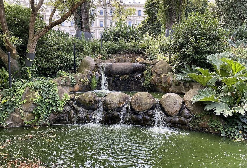 Small landscaped waterfall and pond in Treasury Gardens